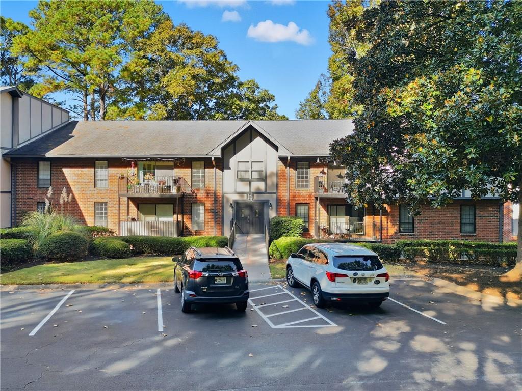 6851 Roswell Road, Unit H29 Atlanta, GA 30328 - Photo 40 of 50 a car parked in front of a house