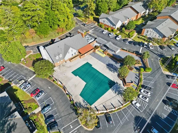 an aerial view of a house with a swimming pool