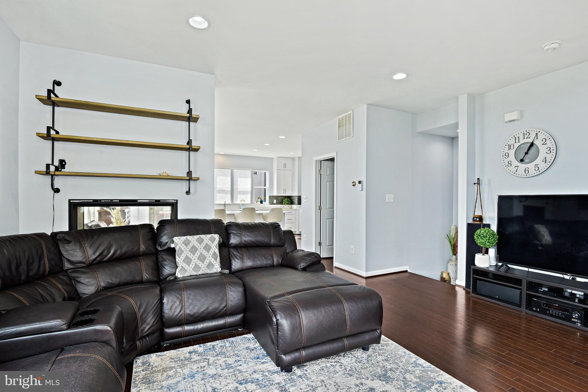42657 Aden Terrace Ashburn, VA 20148 - Photo 8 of 37 Living Room with 2 Way Fireplace