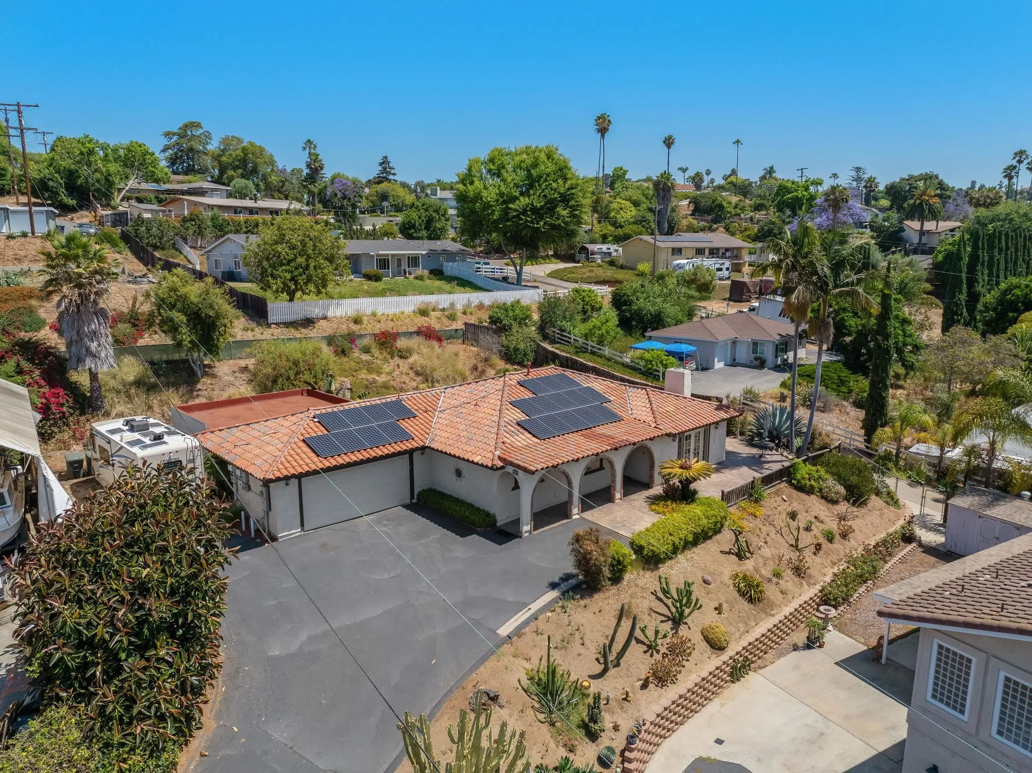 a aerial view of a house with yard swimming pool and outdoor seating