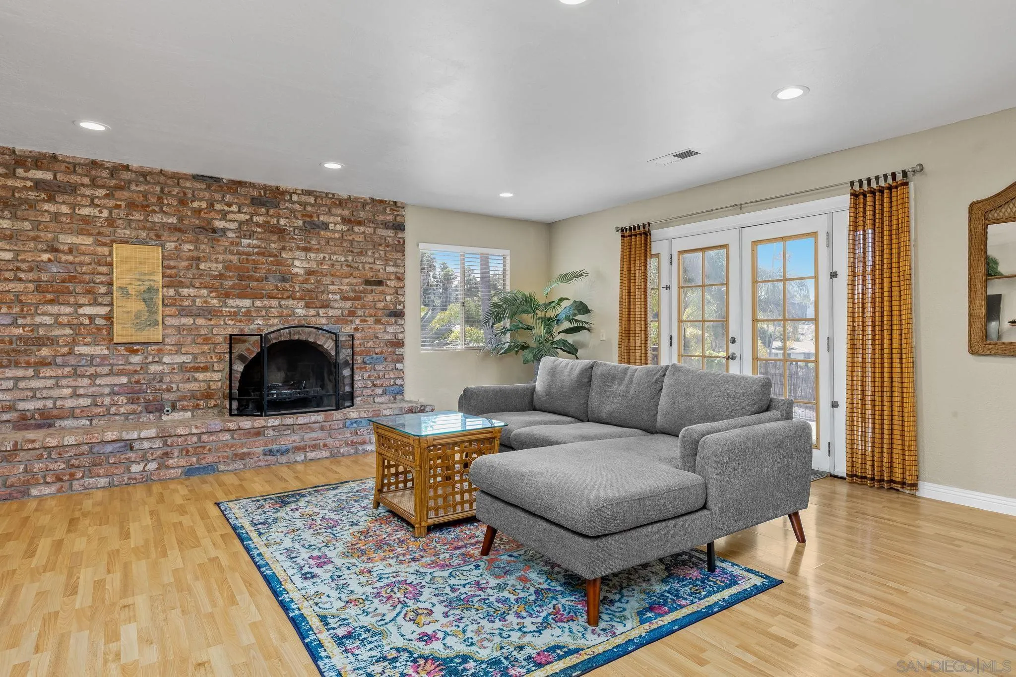 244 Avalon Drive Vista, CA 92084 - Photo 4 of 23 a living room with furniture and a fireplace