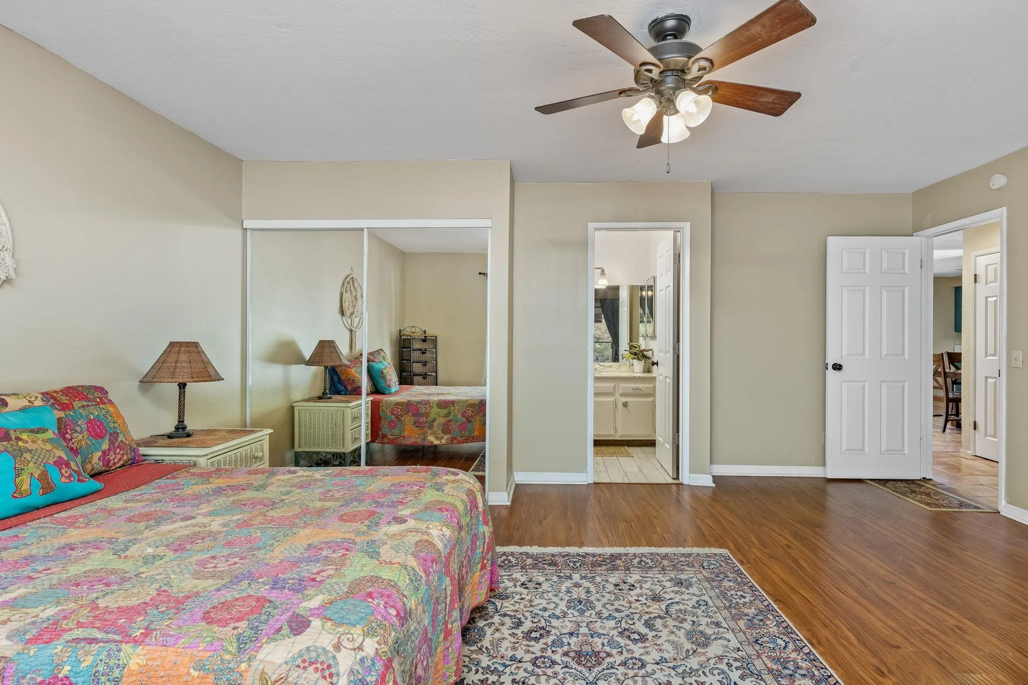 244 Avalon Drive Vista, CA 92084 - Photo 10 of 23 a bedroom with a bed and a chandelier