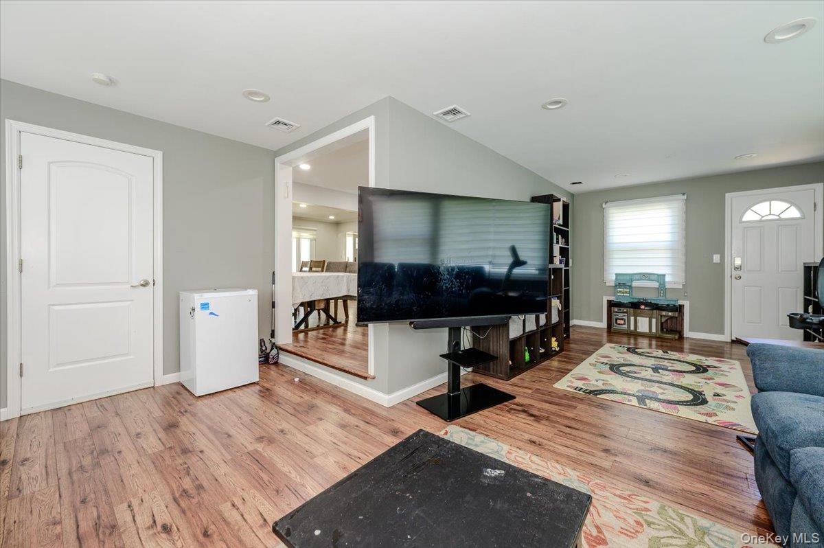 534 Allen Road Woodmere, NY 11598 - Photo 12 of 35 a living room with furniture and a flat screen tv