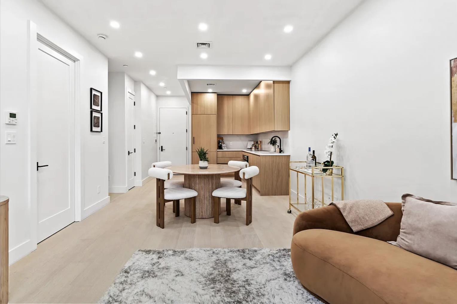 204 Withers Street, Unit 2 Brooklyn, NY 11211 - Photo 3 of 8 a living room with furniture wooden floor and a table
