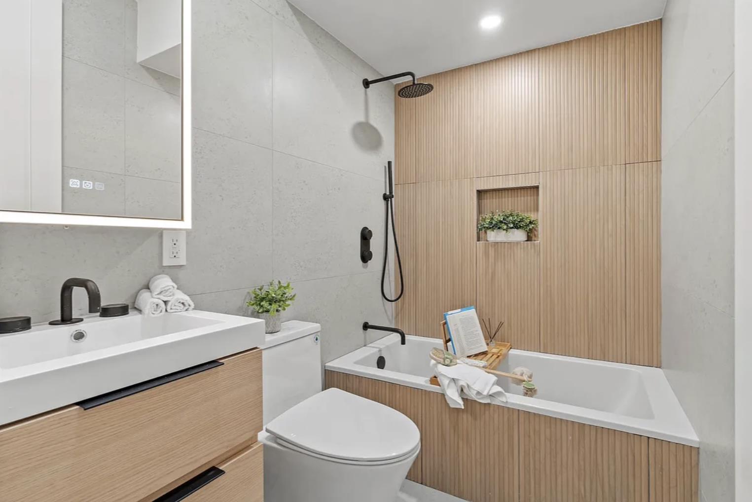 204 Withers Street, Unit 2 Brooklyn, NY 11211 - Photo 6 of 8 a bathroom with a sink a toilet and shower