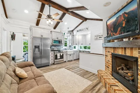 a bathroom with a toilet a sink and a window