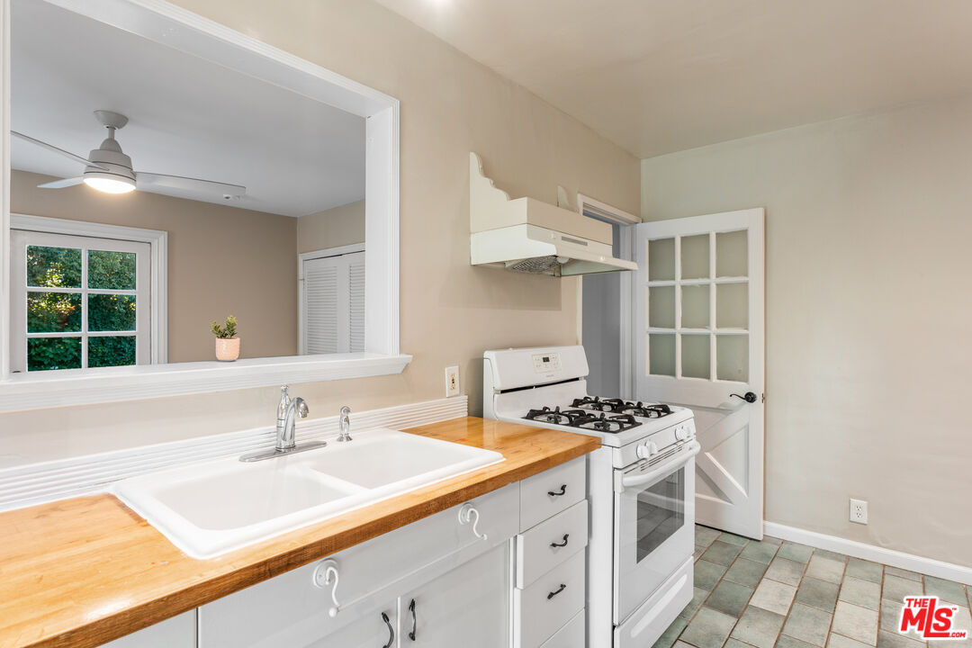 6327 Ranchito Avenue Valley Glen, CA 91401 - Photo 11 of 46 a bathroom with a sink and a mirror