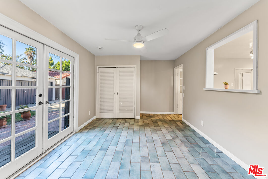 6327 Ranchito Avenue Valley Glen, CA 91401 - Photo 15 of 46 a view of empty room with wooden floor and fan