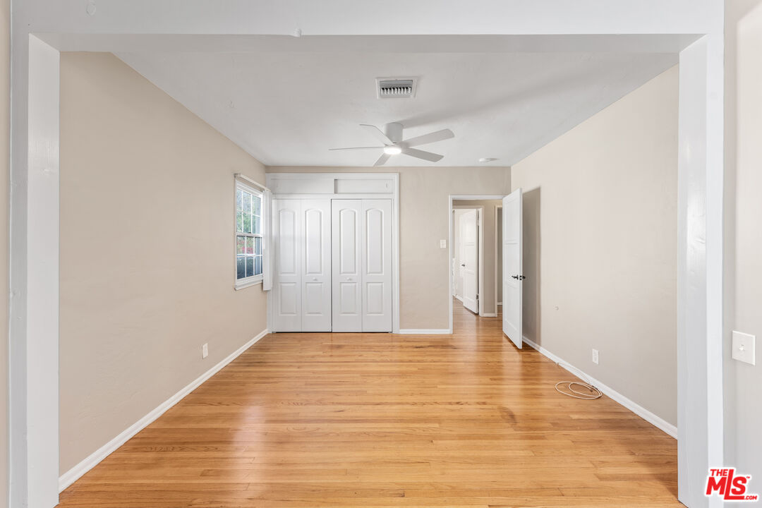 6327 Ranchito Avenue Valley Glen, CA 91401 - Photo 22 of 46 a view of an empty room and wooden floor