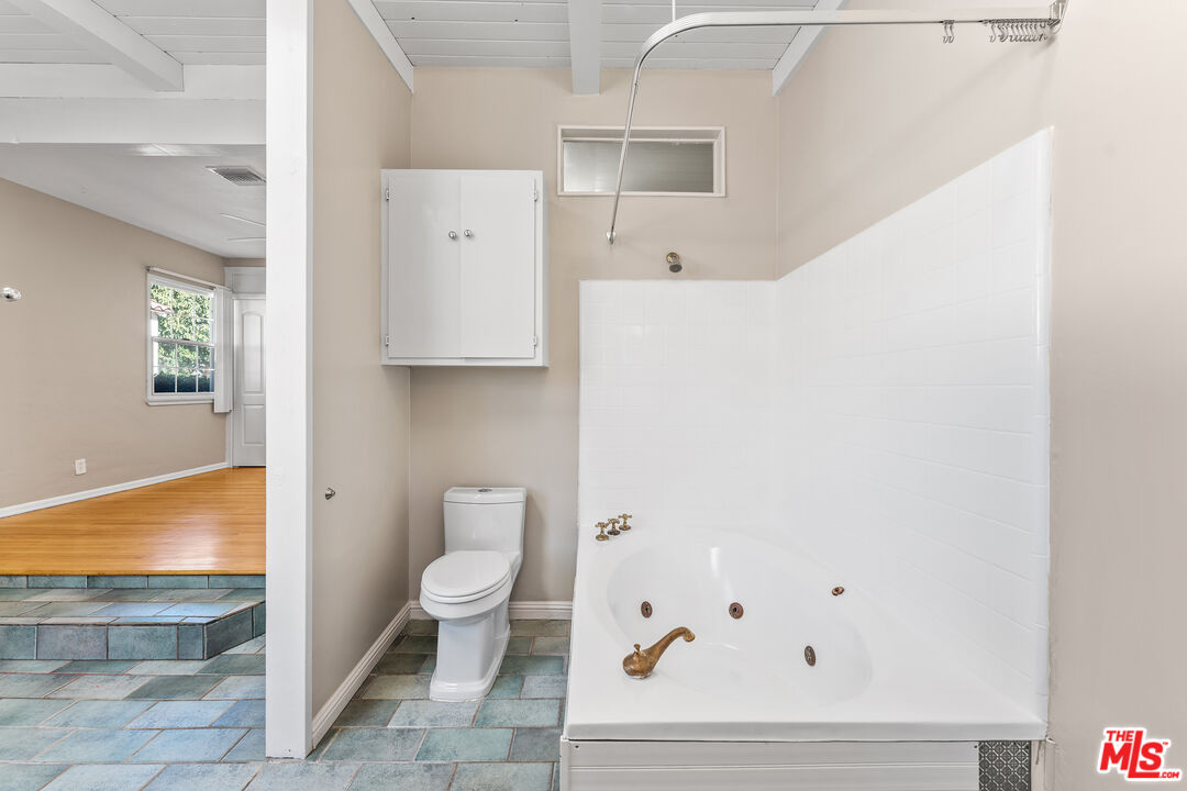 6327 Ranchito Avenue Valley Glen, CA 91401 - Photo 29 of 46 a bathroom with a toilet tub and a shower