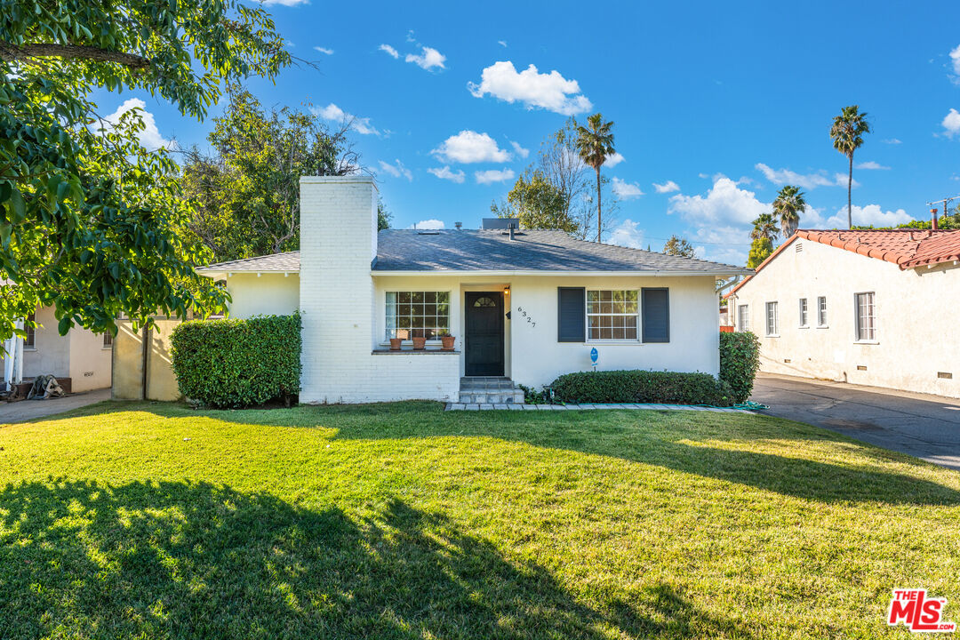 6327 Ranchito Avenue Valley Glen, CA 91401 - Photo 3 of 46 a view of a house with swimming pool and a yard
