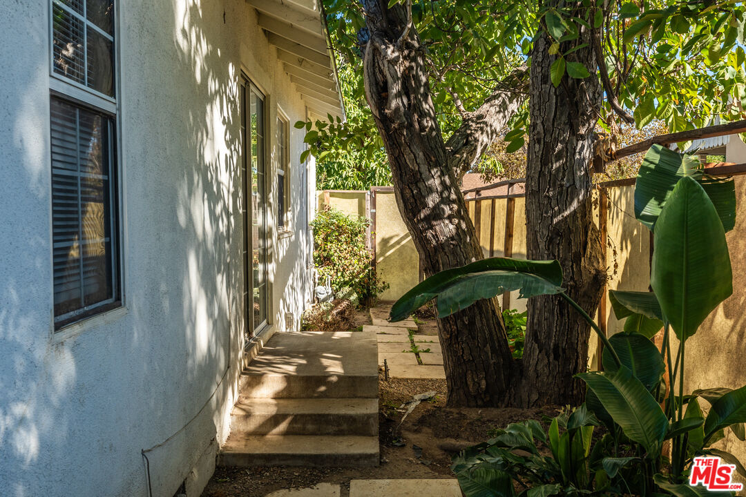 6327 Ranchito Avenue Valley Glen, CA 91401 - Photo 33 of 46 a front view of a house with a garden