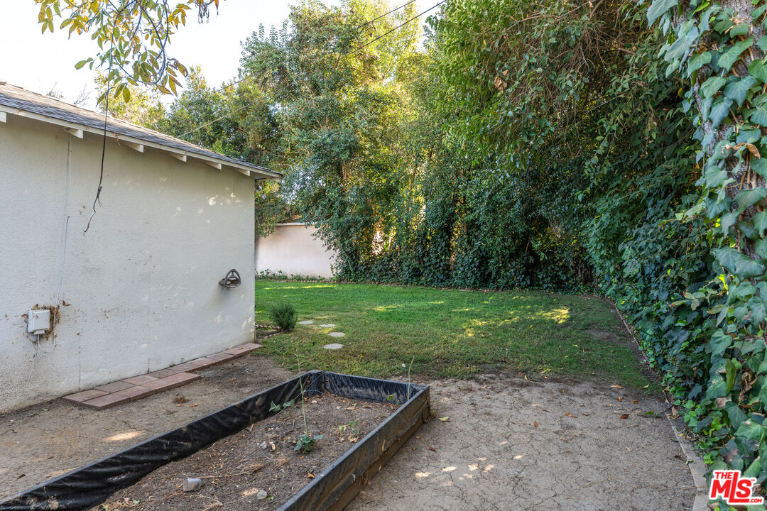6327 Ranchito Avenue Valley Glen, CA 91401 - Photo 37 of 46 a backyard of a house with lots of green space