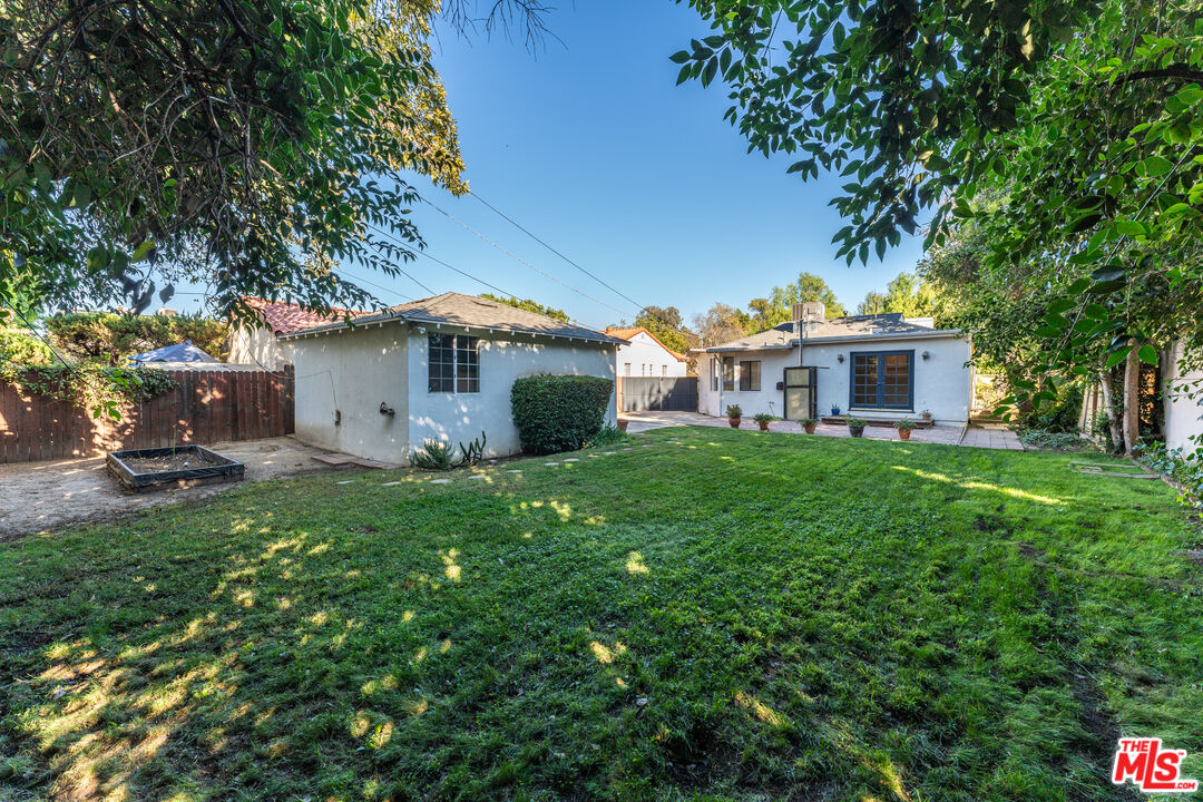 6327 Ranchito Avenue Valley Glen, CA 91401 - Photo 38 of 46 a front view of a house with garden