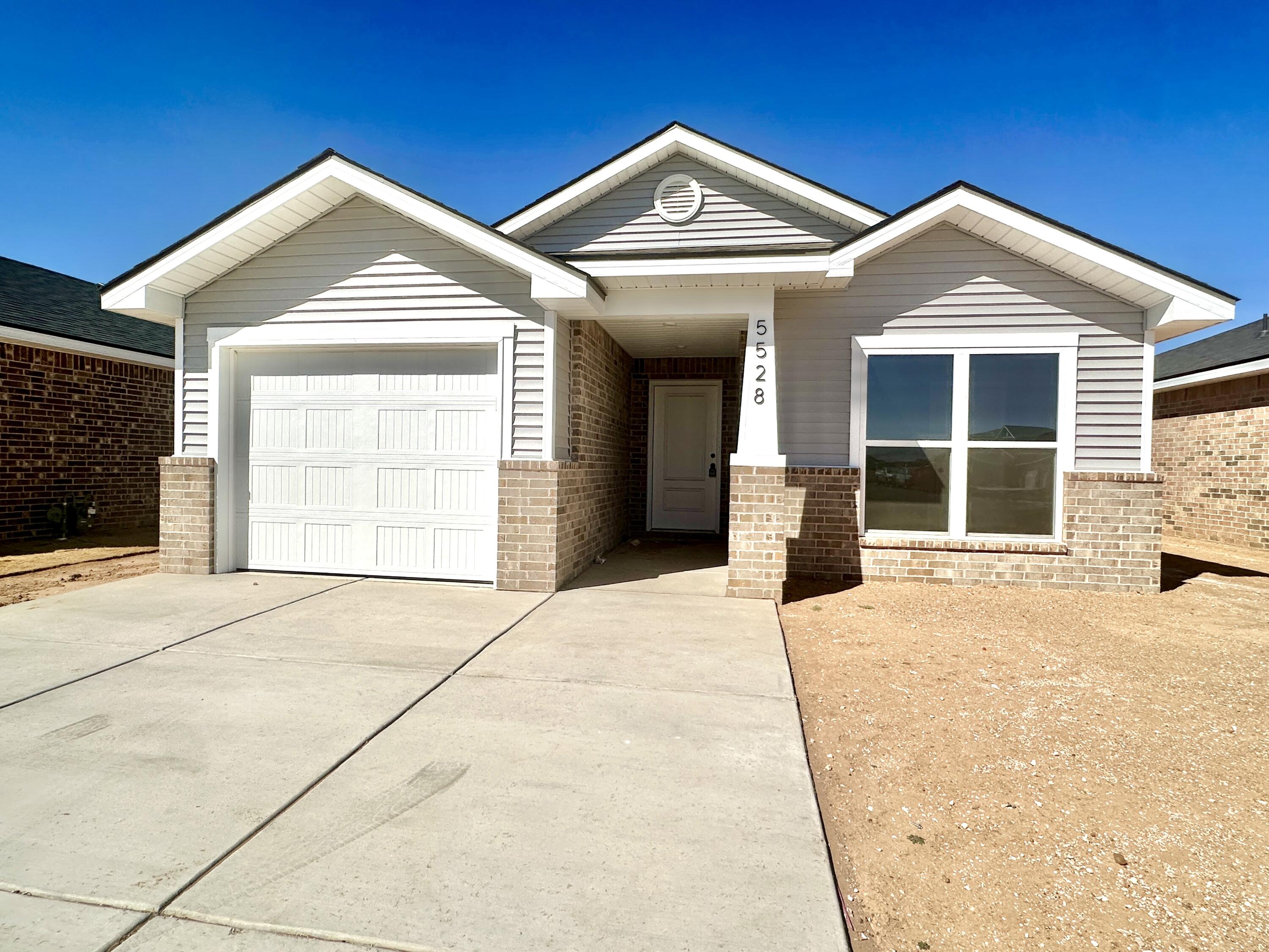 5528 Princeton Street Lubbock, TX 79416 - Photo 1 of 10 a front view of a house with a yard