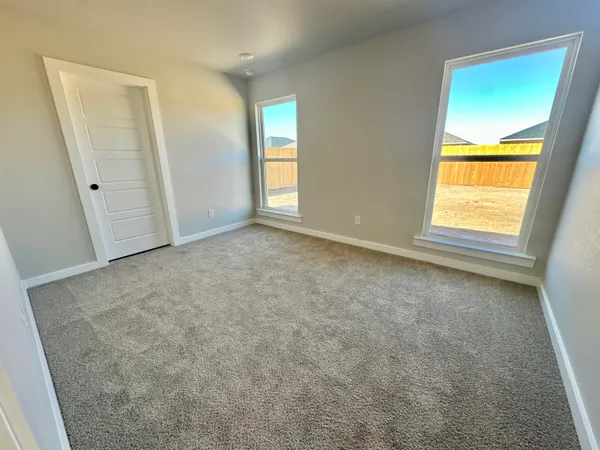 an empty room with windows