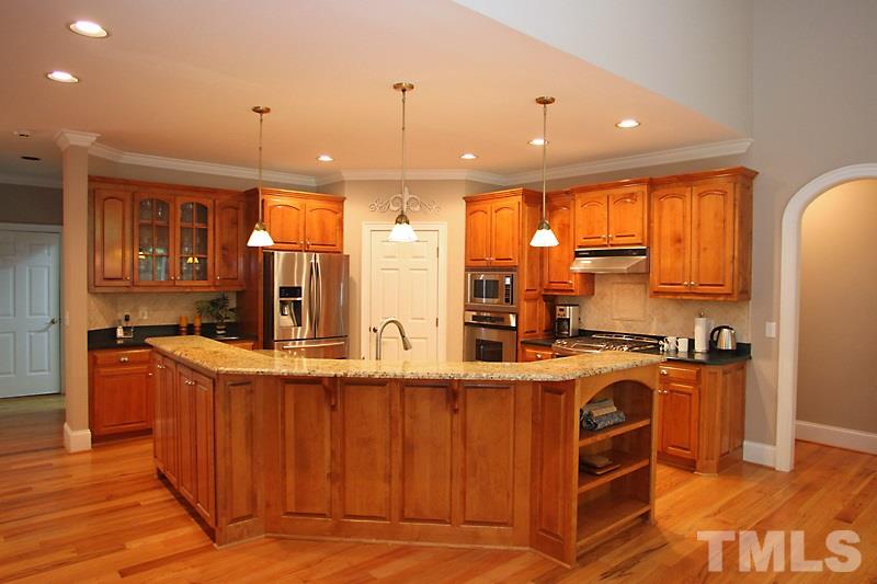 6100 Crupper Court Raleigh, NC 27613 - Photo 7 of 15 Chef's Kitchen Package with upgraded Gas Range. Granite Counter Tops hardwood floors.