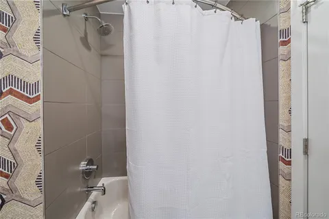 a bathroom with a shower and a toilet