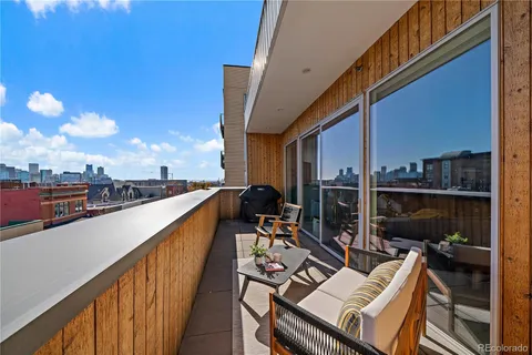 a view of balcony with furniture