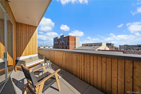 a view of a balcony with furniture