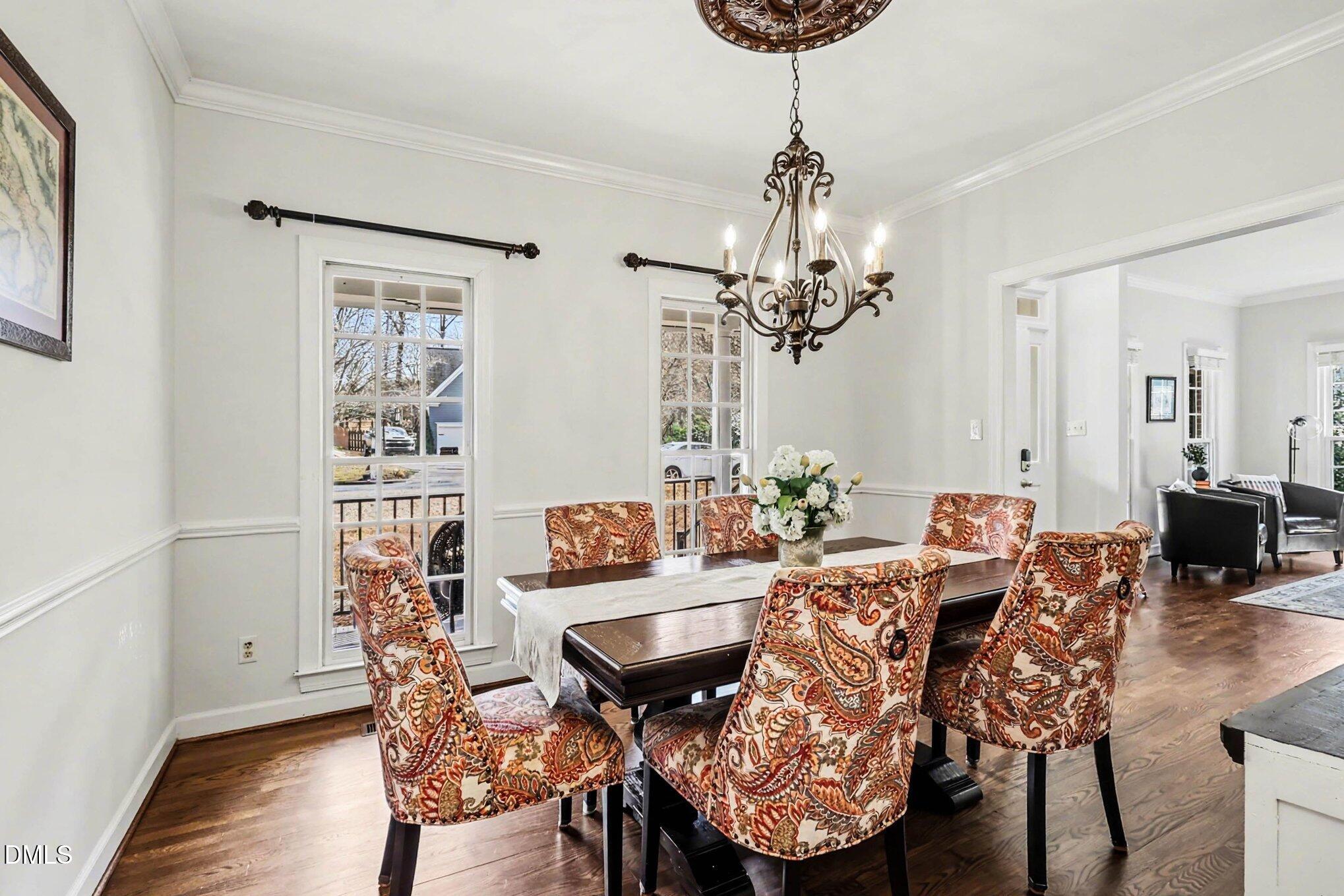 119 Felspar Way Cary, NC 27518 - Photo 11 of 53 a view of a dining room with furniture and wooden floor