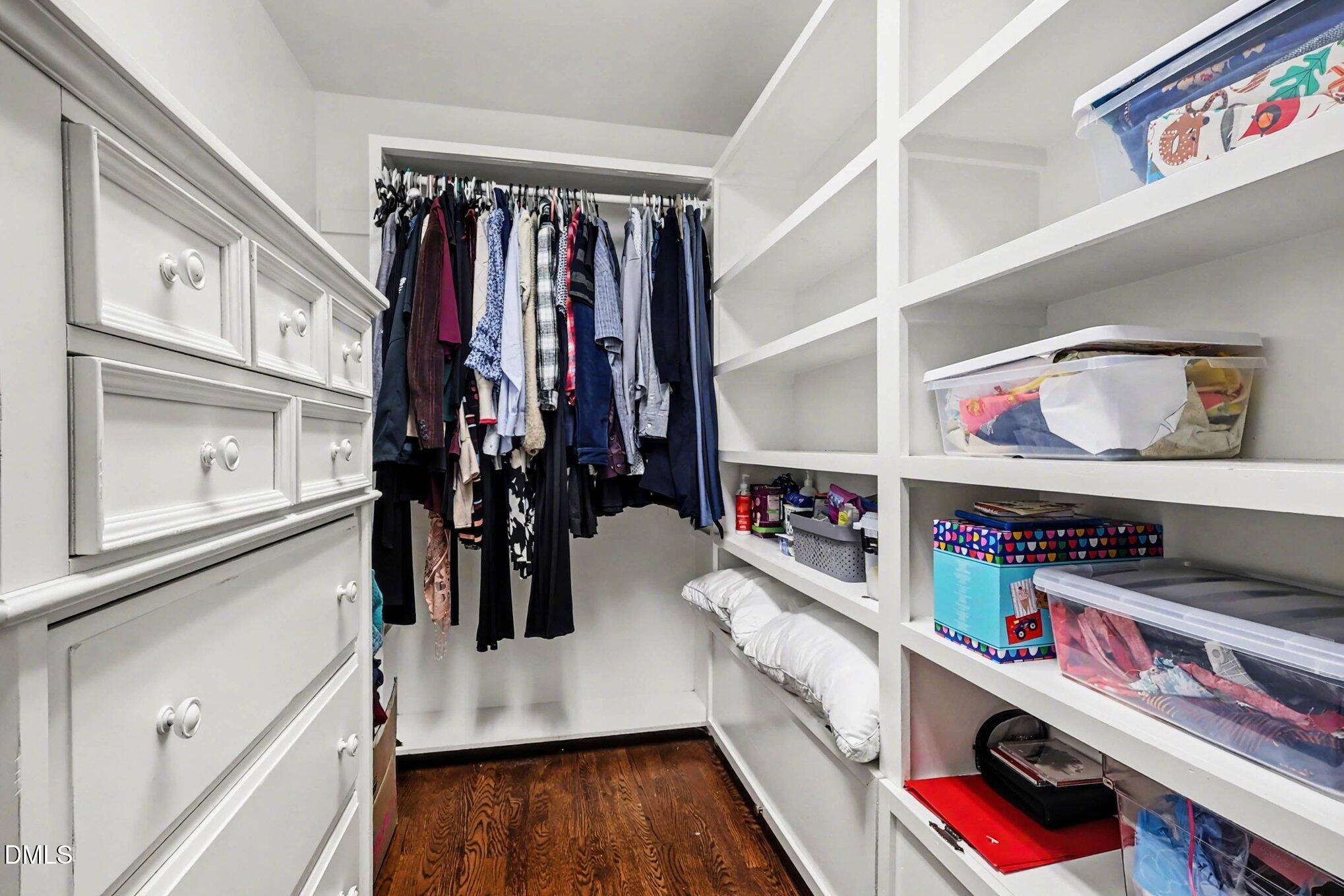 119 Felspar Way Cary, NC 27518 - Photo 18 of 53 a view of walk in closet with clothes and shoes