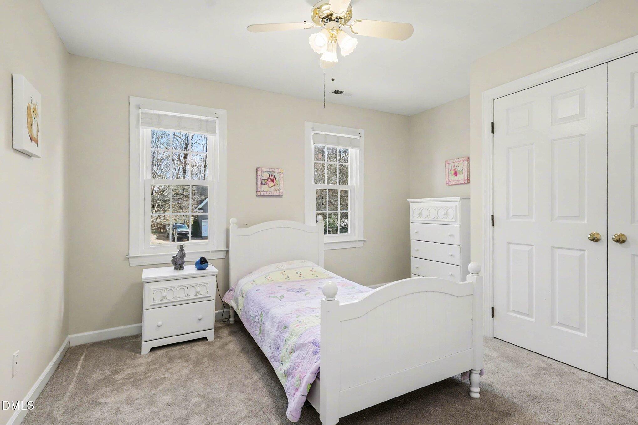 119 Felspar Way Cary, NC 27518 - Photo 22 of 53 a bedroom with a bed and a window