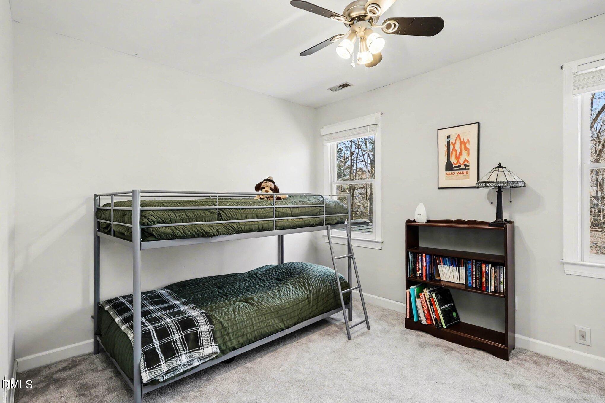 119 Felspar Way Cary, NC 27518 - Photo 24 of 53 a bedroom with furniture and a fan