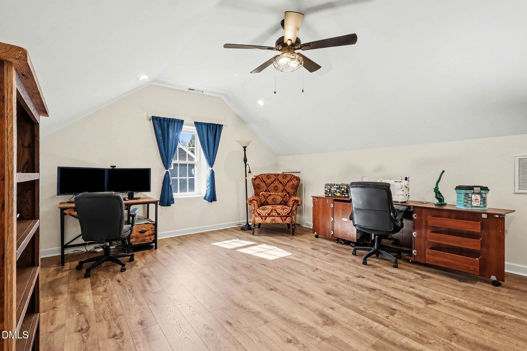 119 Felspar Way Cary, NC 27518 - Photo 30 of 53 a view of a workspace with furniture and a ceiling fan