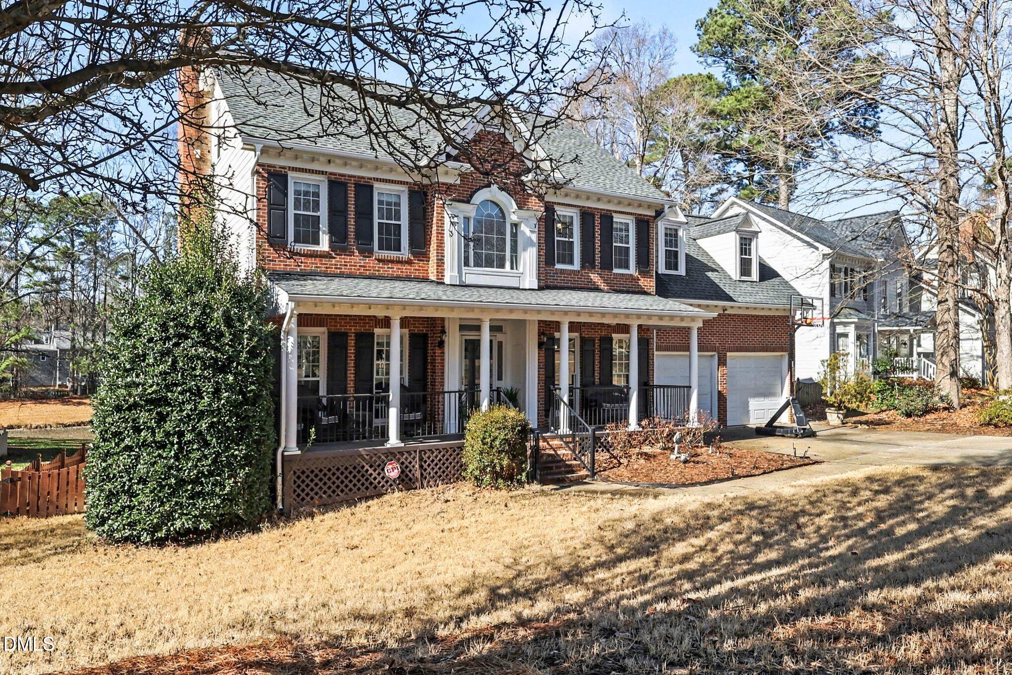 119 Felspar Way Cary, NC 27518 - Photo 3 of 53 a front view of a house with a yard covered in snow