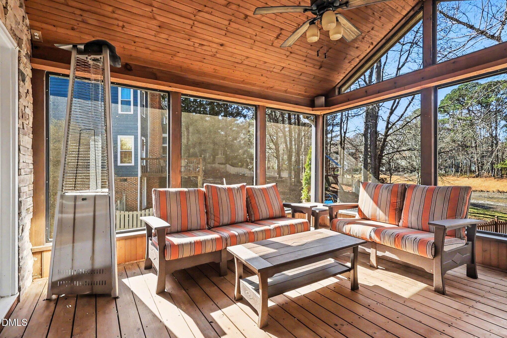 119 Felspar Way Cary, NC 27518 - Photo 33 of 53 a living room with furniture and a floor to ceiling window