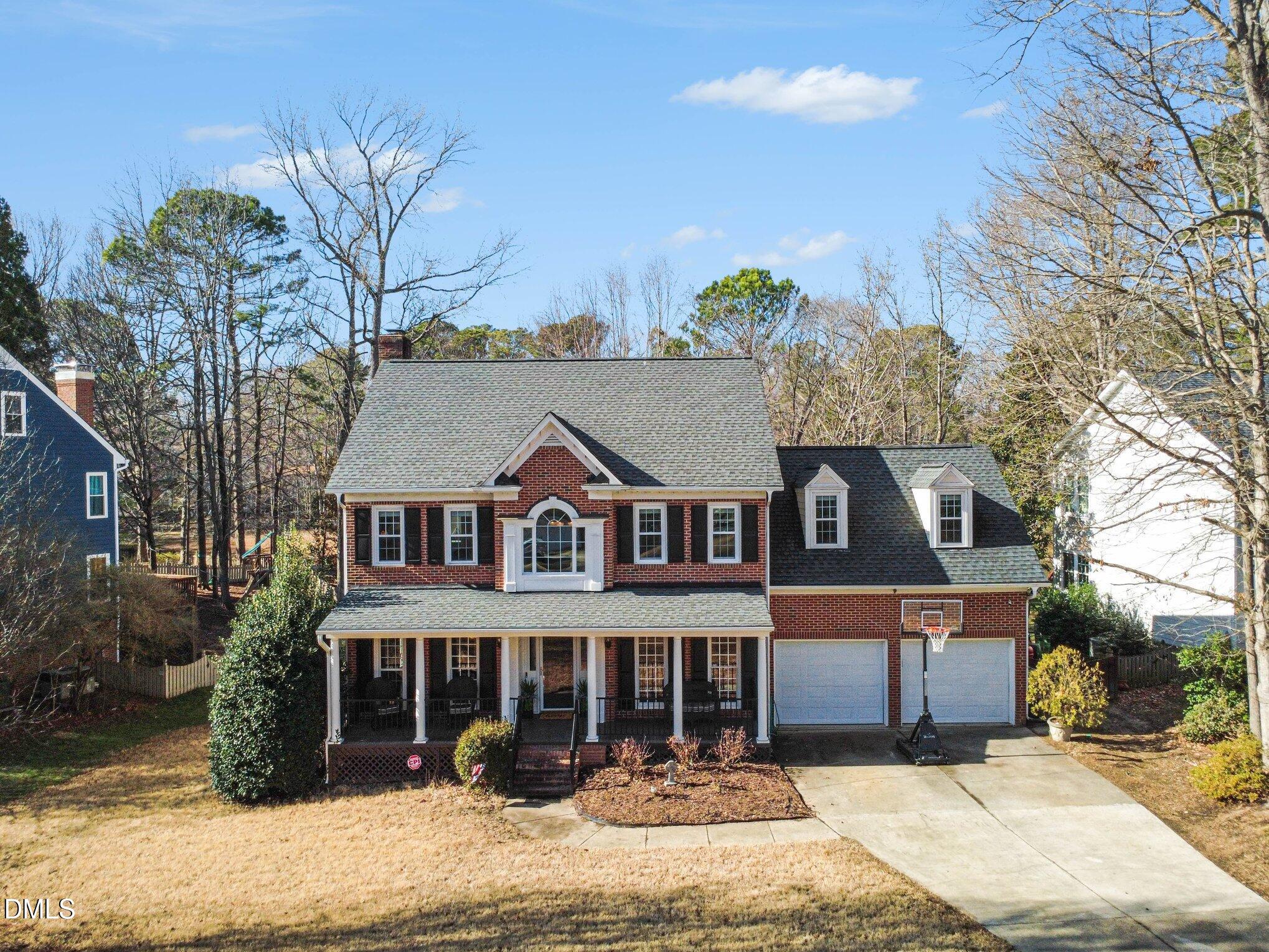 119 Felspar Way Cary, NC 27518 - Photo 4 of 53 a front view of a house with a garden