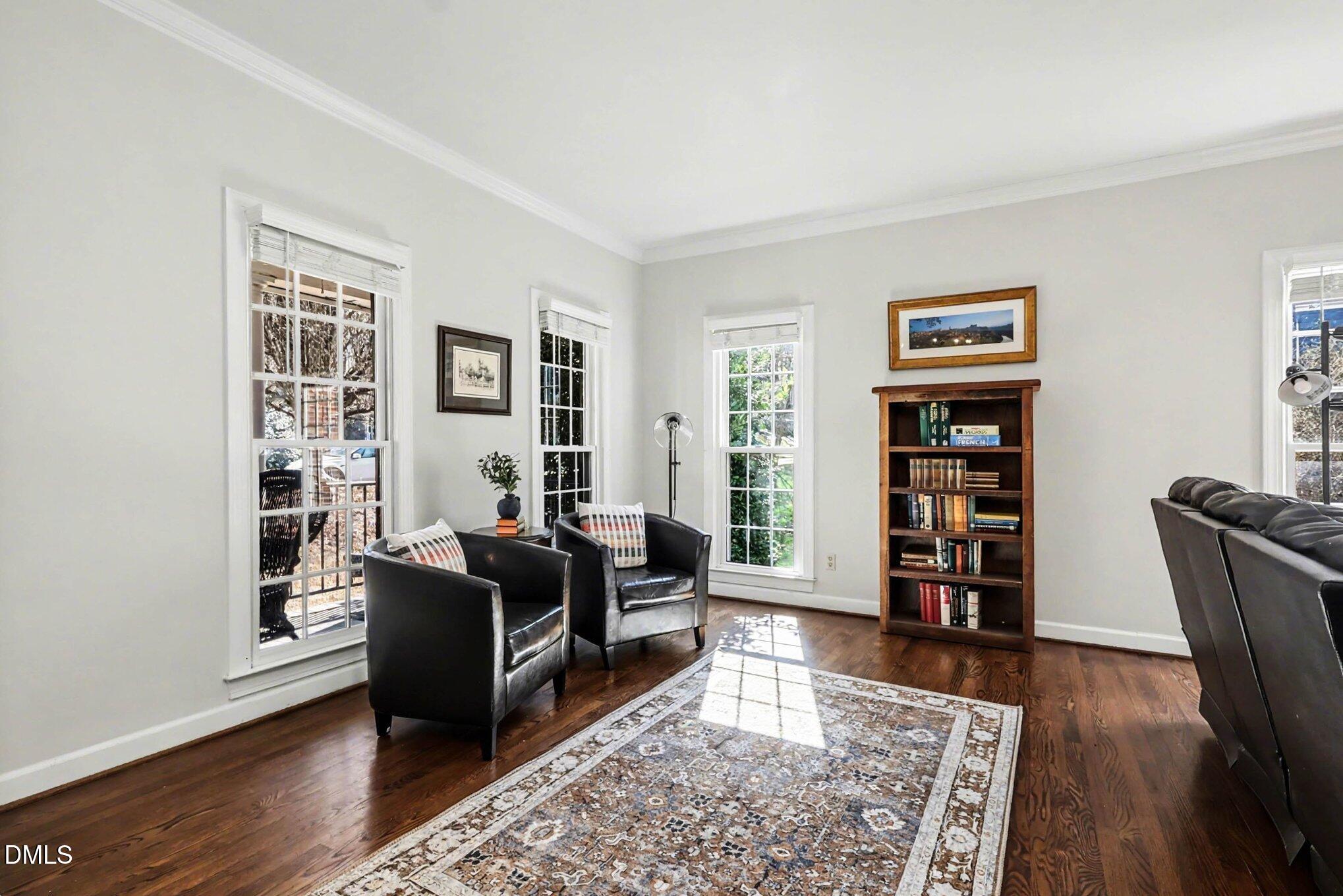 119 Felspar Way Cary, NC 27518 - Photo 6 of 53 a living room with furniture and a book shelf