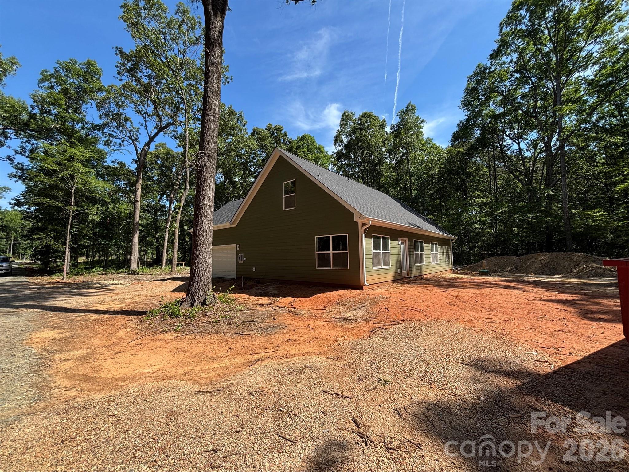 1818 New Salem Road Monroe, NC 28110 - Photo 5 of 8 a tall house with a large tree in front of it
