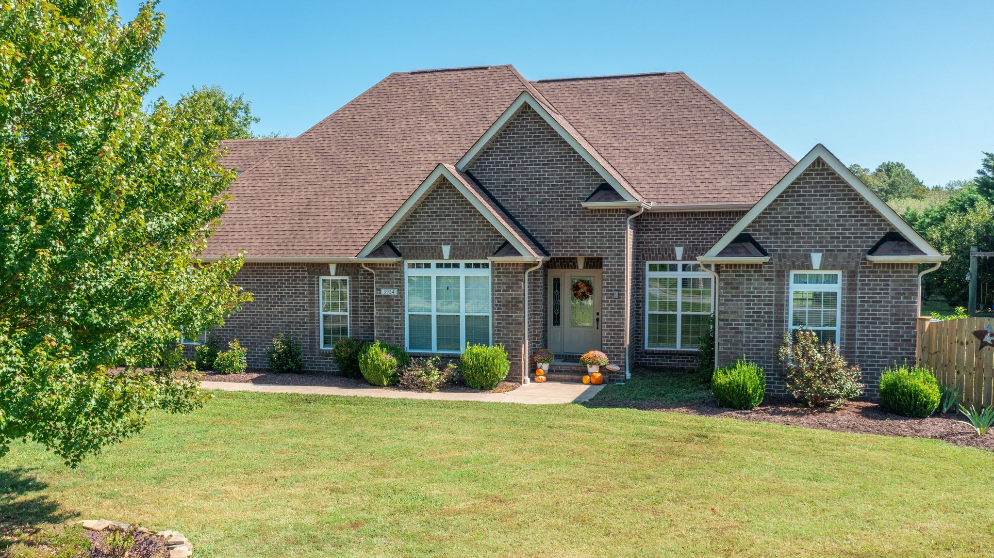 a front view of a house with garden