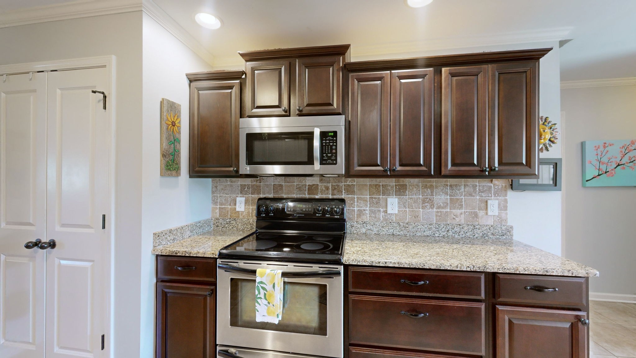 3924 Rowland Road Murfreesboro, TN 37128 - Photo 14 of 53 a kitchen with granite countertop a stove and a microwave