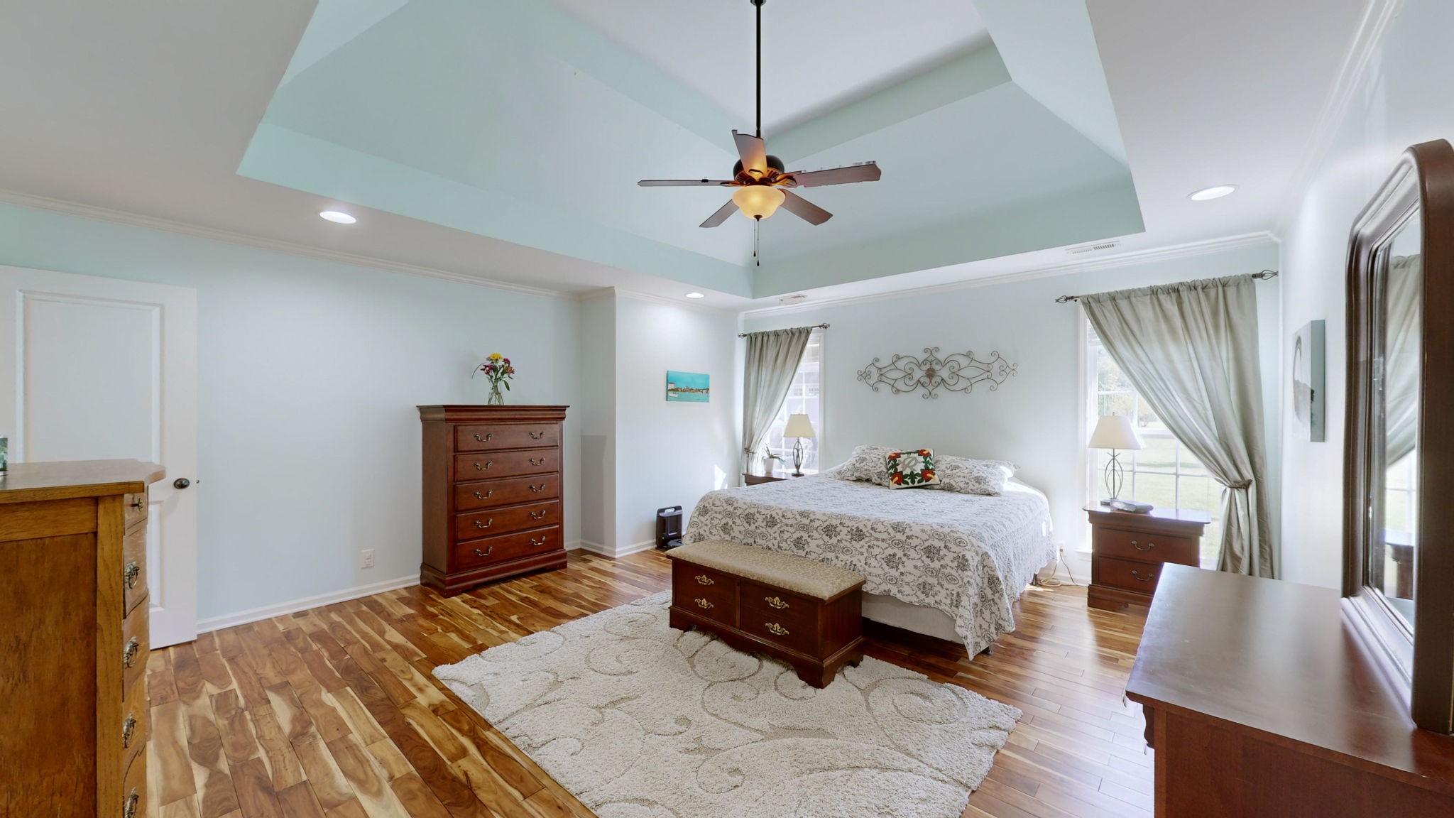 3924 Rowland Road Murfreesboro, TN 37128 - Photo 19 of 53 a bedroom with a bed a dresser and potted plant with the wooden floor