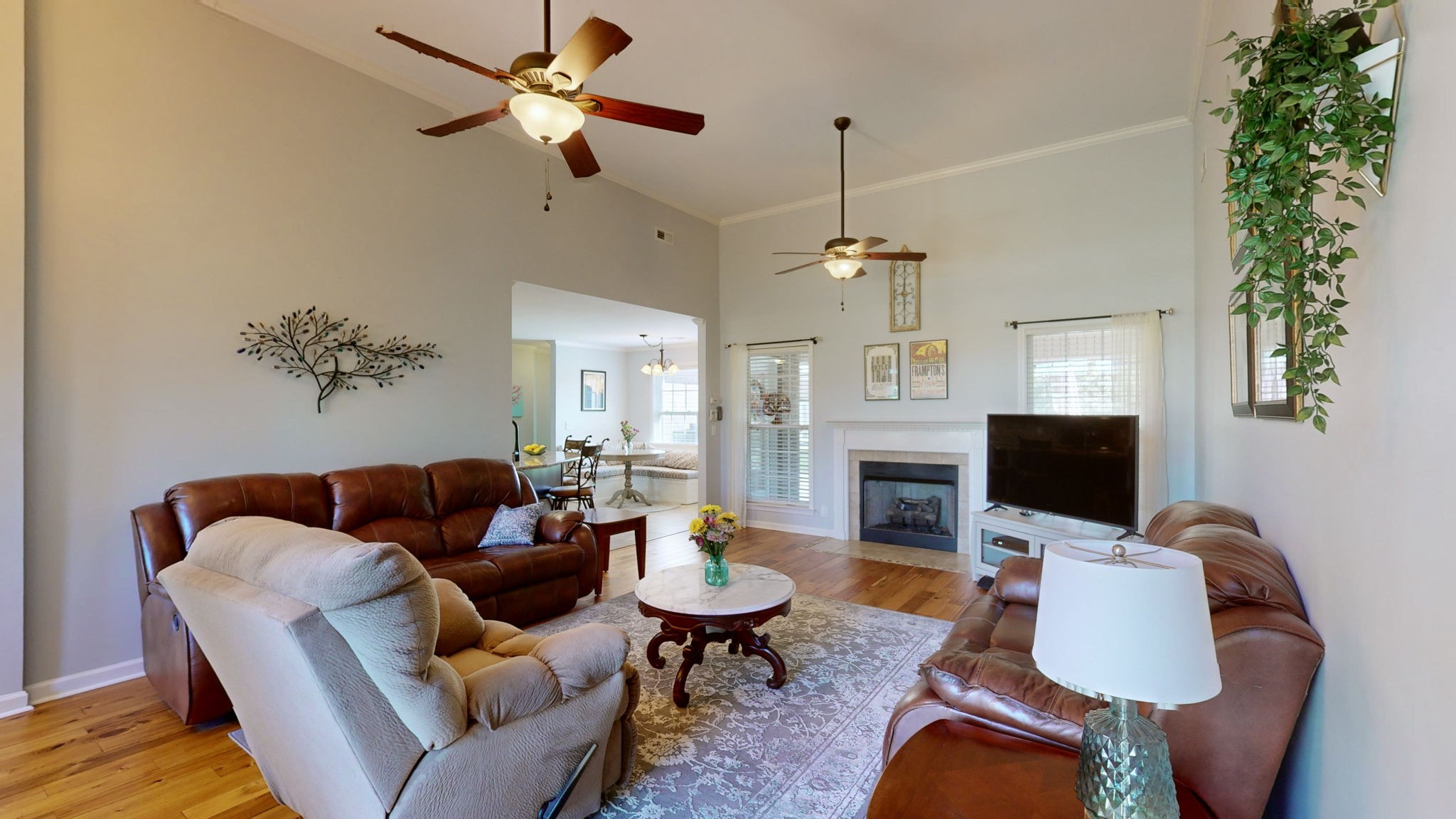 3924 Rowland Road Murfreesboro, TN 37128 - Photo 5 of 53 a living room with furniture a chandelier and a flat screen tv