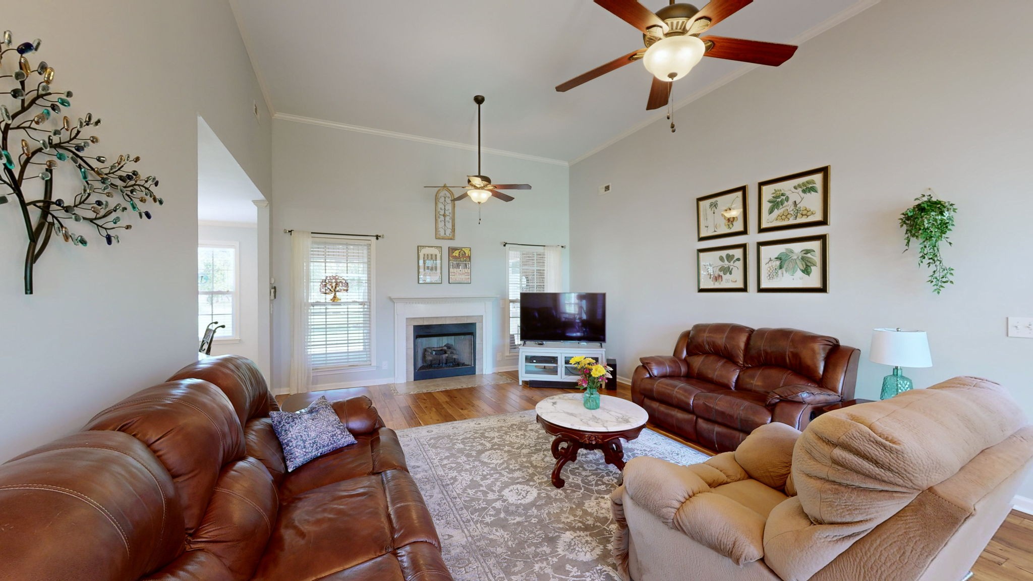 3924 Rowland Road Murfreesboro, TN 37128 - Photo 6 of 53 a living room with furniture a fireplace and a chandelier