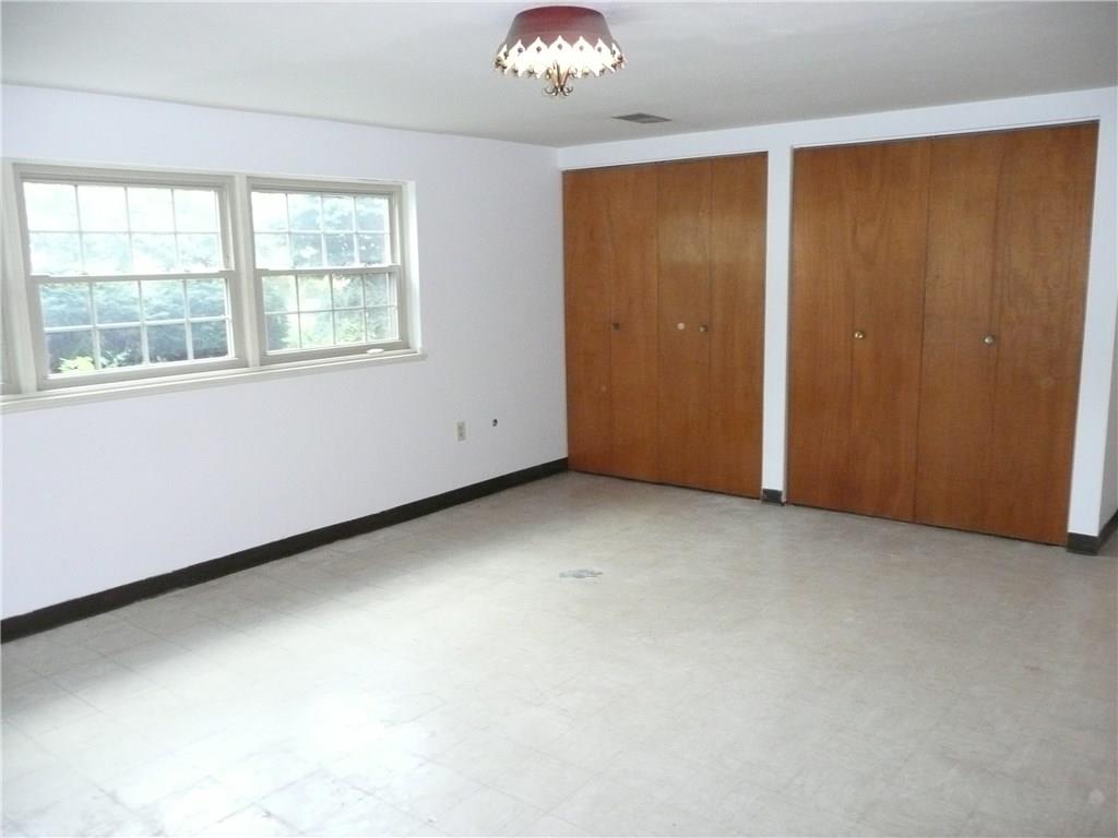 234 Lytton Road Coraopolis, PA 15108 - Photo 14 of 20 FAMILY ROOM WITH WALL OF STORAGE CLOSETS