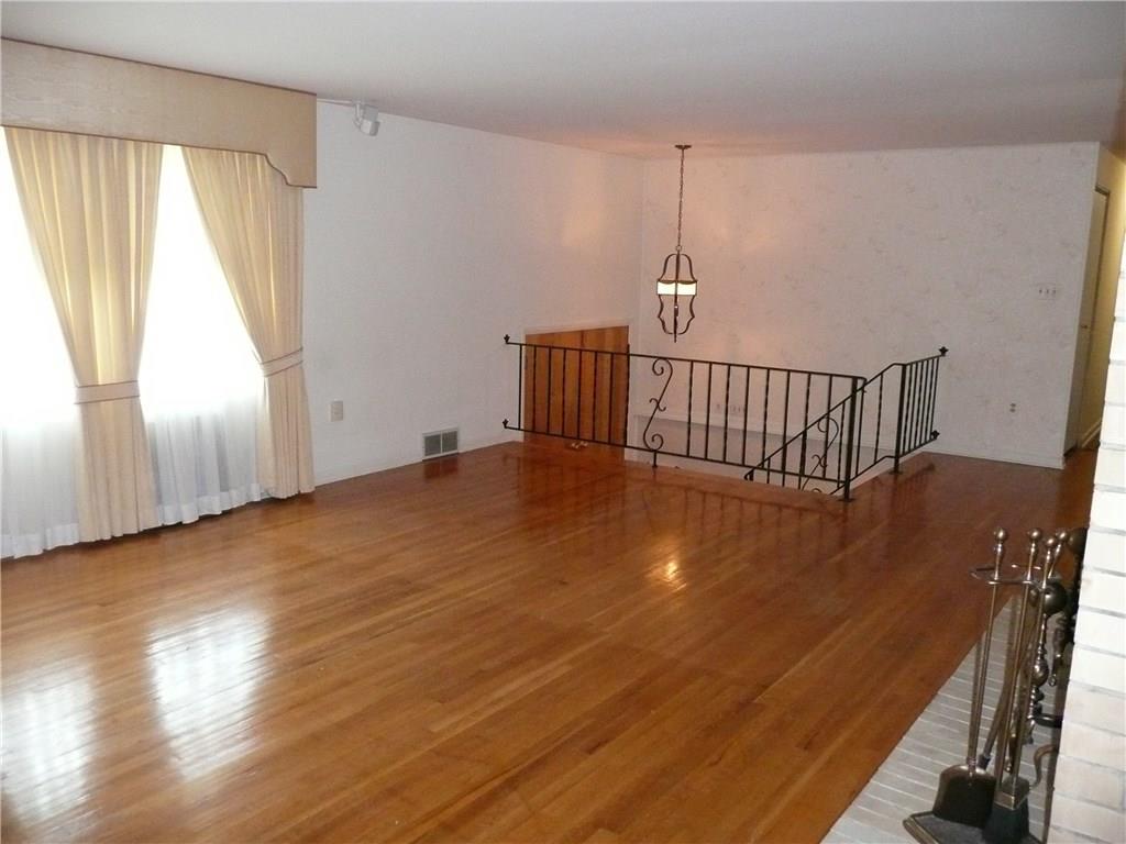 234 Lytton Road Coraopolis, PA 15108 - Photo 4 of 20 NEUTRAL DECOR, AND WALL OF WINDOWS THAT BRINGS IN LOT OF LIGHT