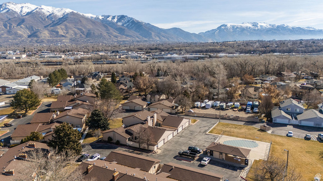 621 Coachman Way Riverdale, UT 84405 - Photo 35 of 38 Aerial perspective of suburban area with mountains