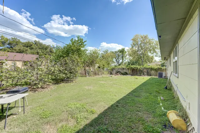 a backyard of a house with lots of green space