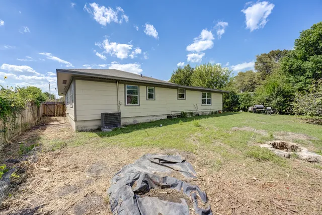 a backyard of a house with lots of green space