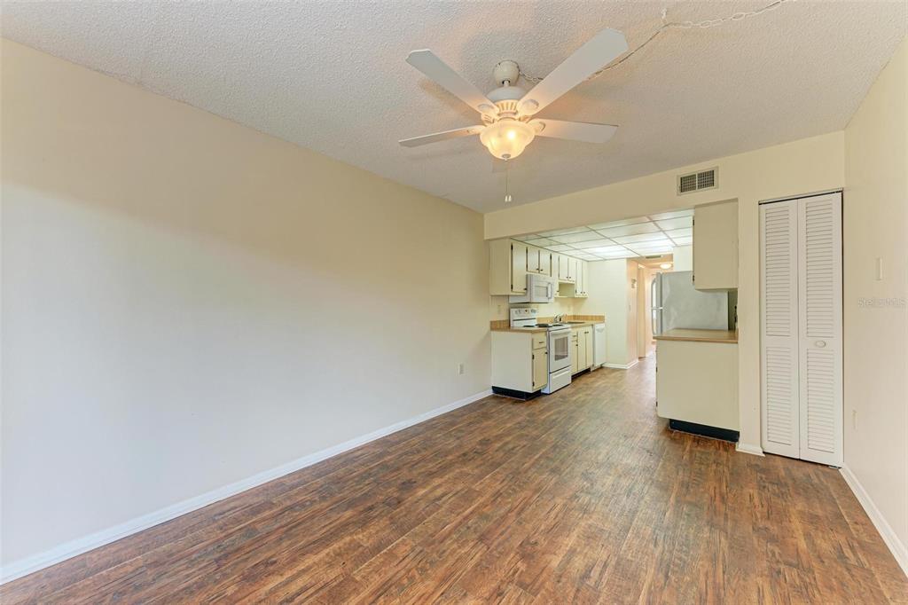 305 30th Avenue West, Unit A210 Bradenton, FL 34205 - Photo 10 of 33 a view of a kitchen with a sink and dishwasher in a white cabinet