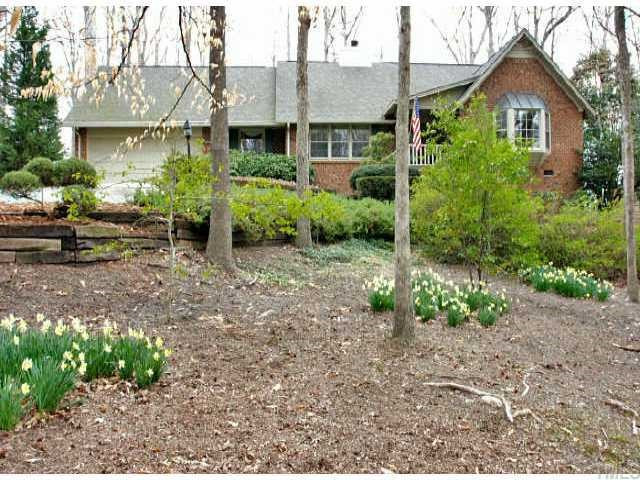 113 Queensferry Road Cary, NC 27511 - Photo 1 of 9 a view of a house with a yard and sitting area