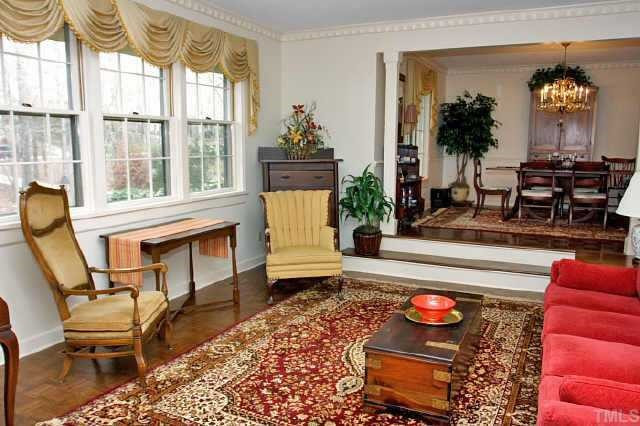 113 Queensferry Road Cary, NC 27511 - Photo 2 of 9 a living room filled with furniture and a large window