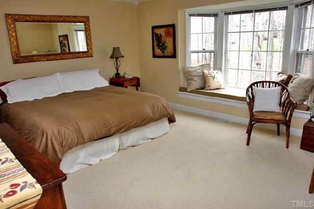 113 Queensferry Road Cary, NC 27511 - Photo 5 of 9 a bedroom with a bed and a window