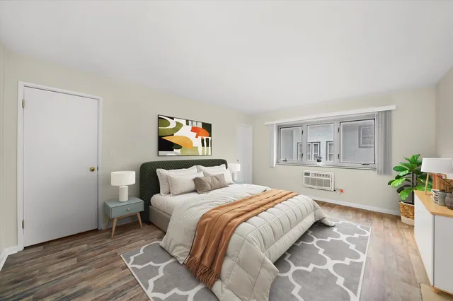 a bedroom with a bed and a couch