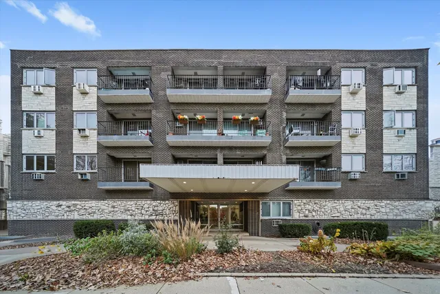 front view of a building with a fountain